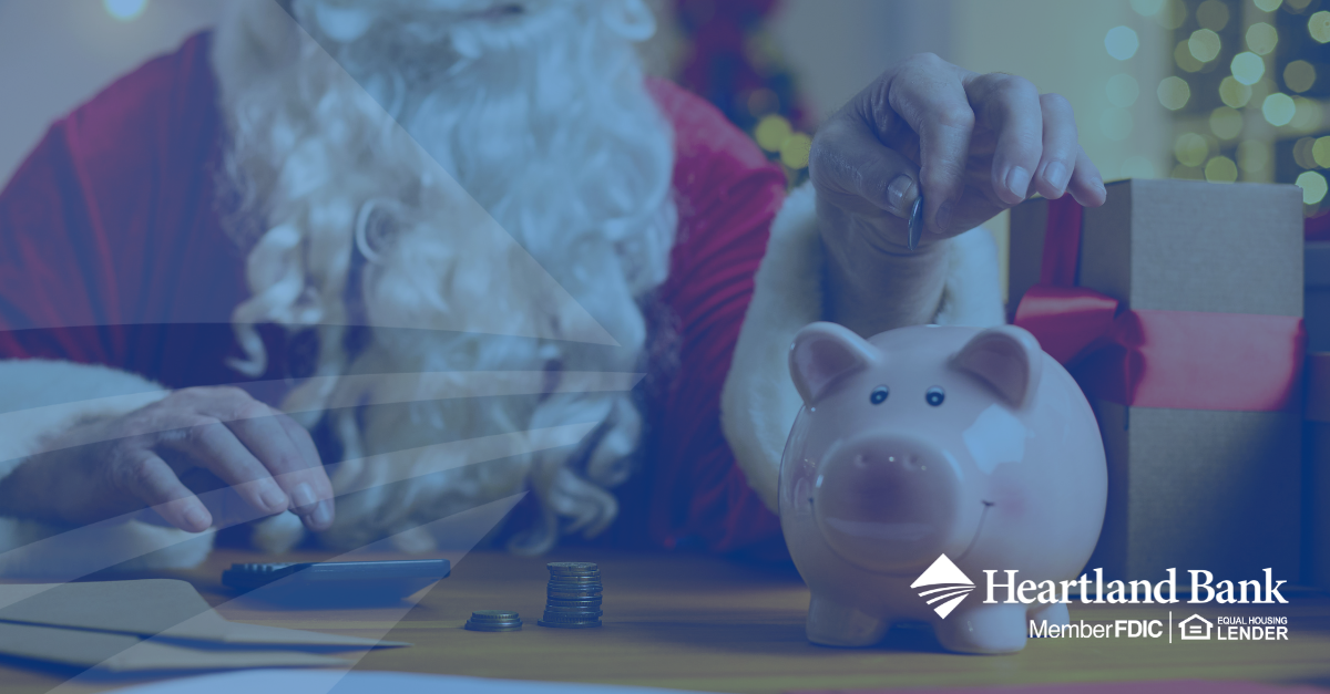 Santa Claus putting coins in a piggy bank, Heartland Bank logo