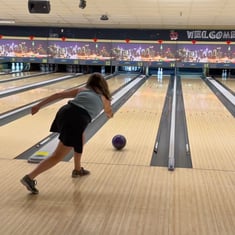 Heartland Bank associate bowling at an associate event.