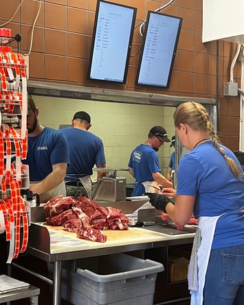 The employees at Belschner's Custom Meats processing and packaging custom meat products.