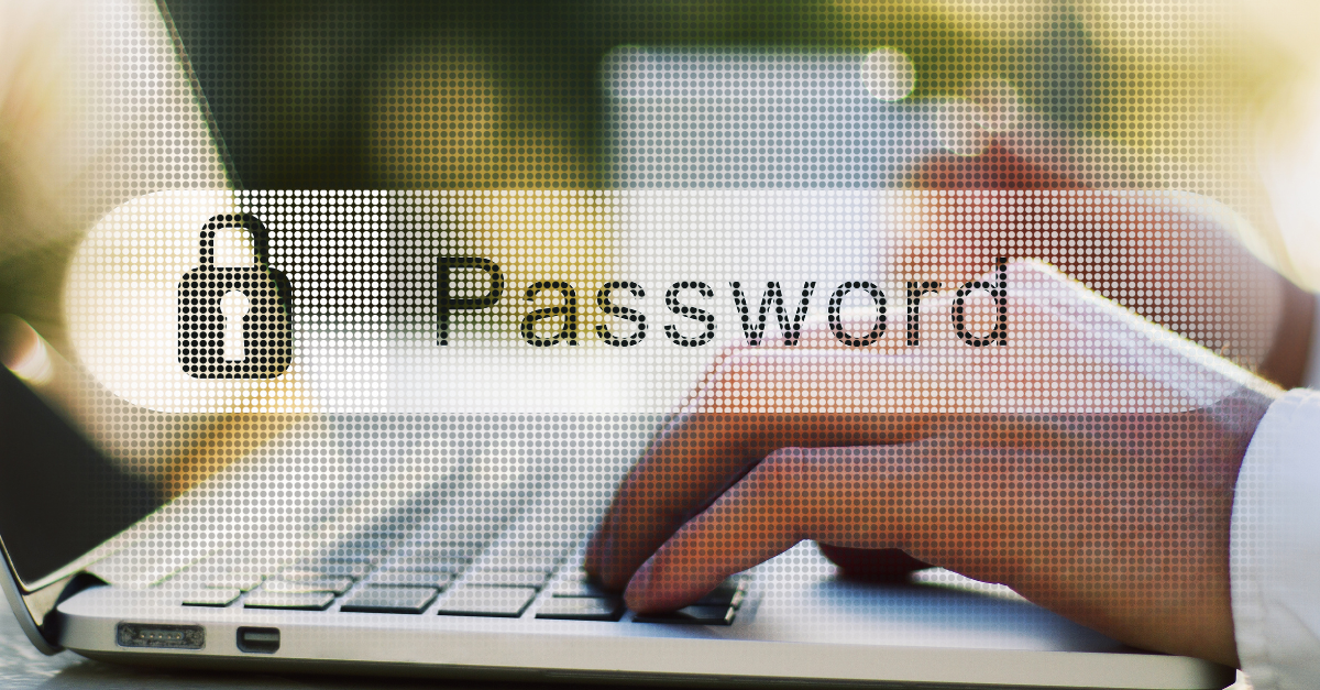 person at computer typing password